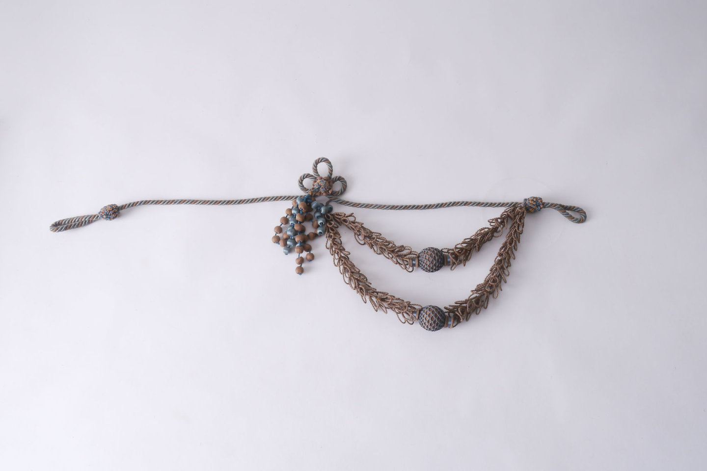 Embrasse câblée of gordijnkoord met schuifring om gordijn open te houden