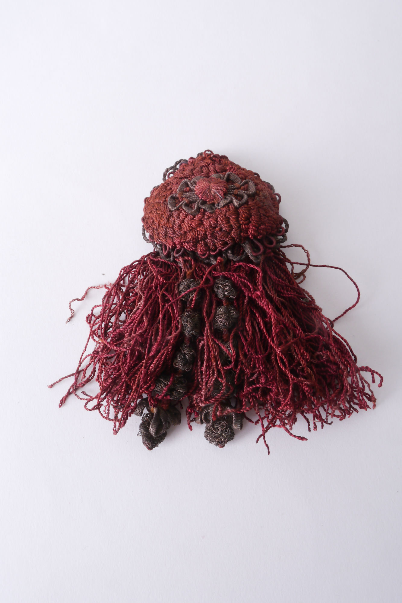 Macaron of rozet als onderdeel voor het vervaardigen van passement