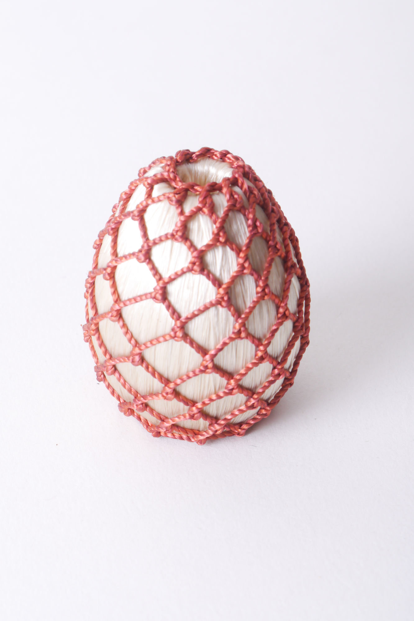 Overtrokken houten vorm als onderdeel voor het vervaardigen van passement