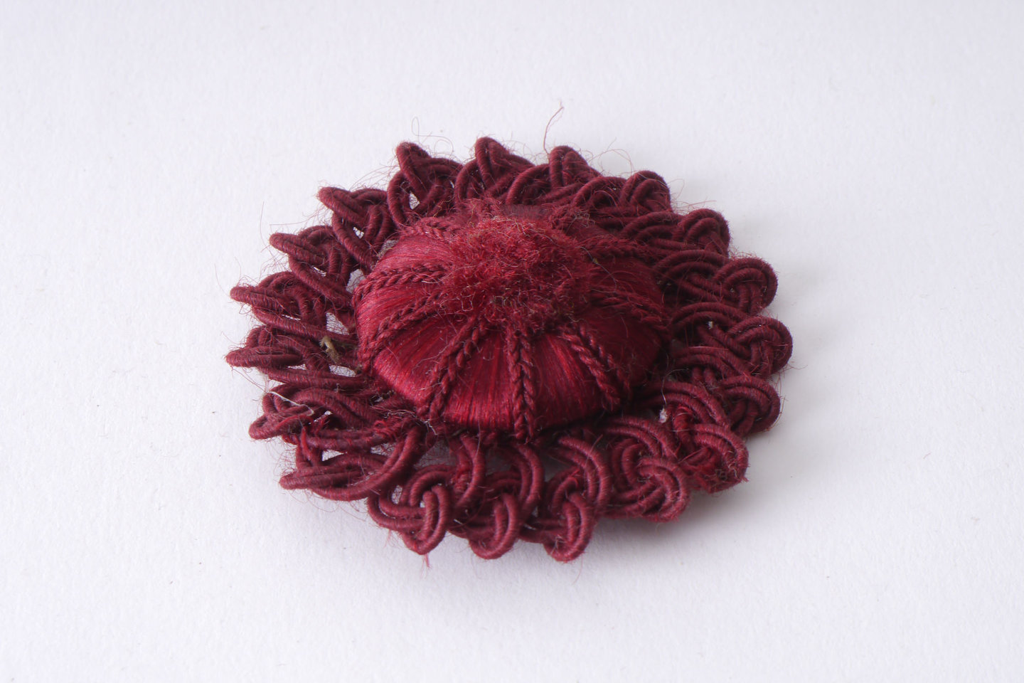 Macaron of rozet als onderdeel voor het vervaardigen van passement