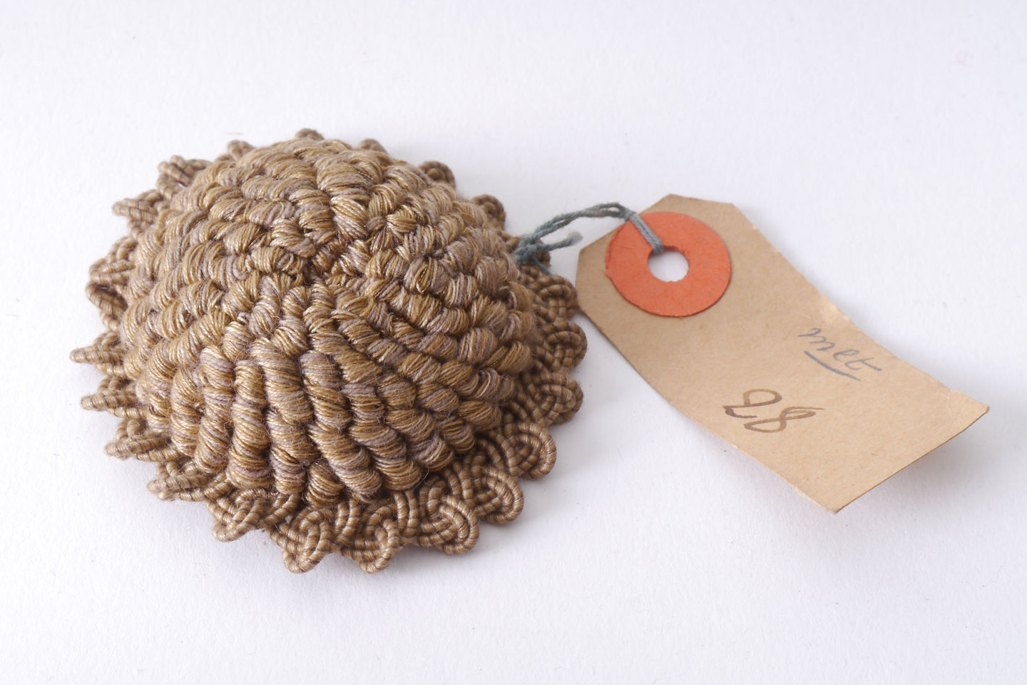 Macaron of rozet als onderdeel voor het vervaardigen van passement