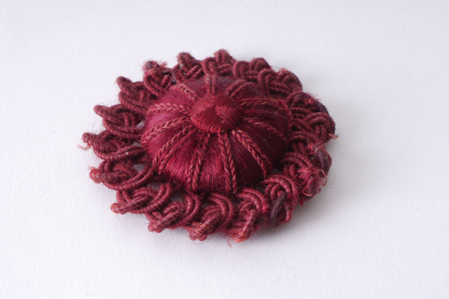 Macaron of rozet als onderdeel voor het vervaardigen van passement