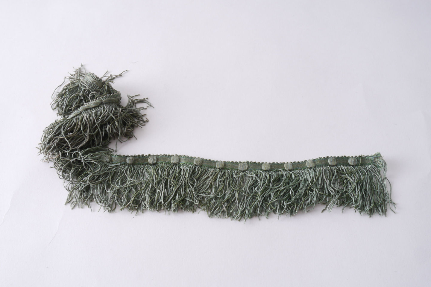 Effilé als onderdeel voor het vervaardigen van passement