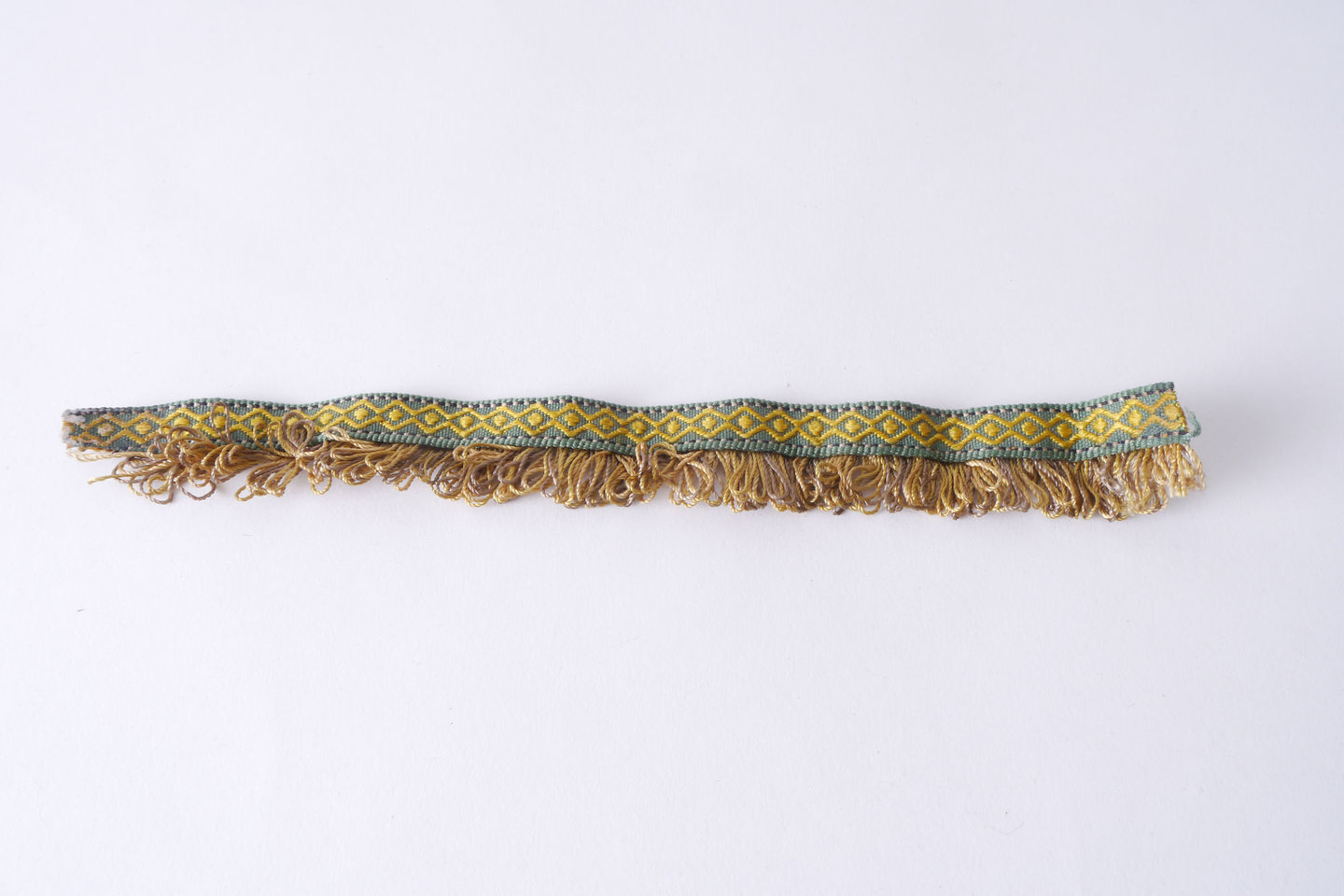 Effilé als onderdeel voor het vervaardigen van passement