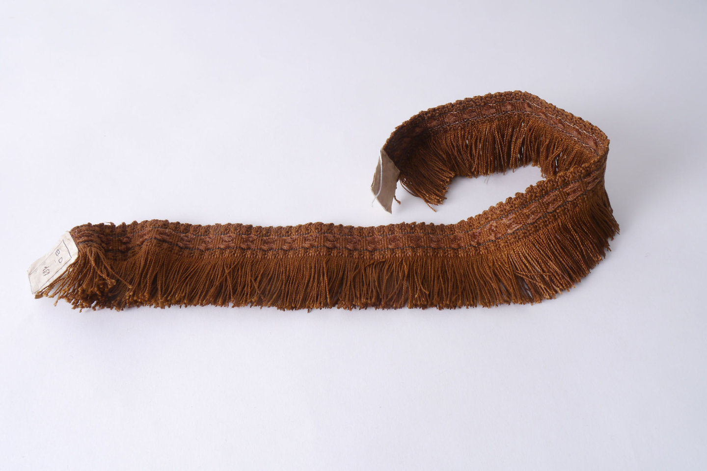 Effilé als onderdeel voor het vervaardigen van passement