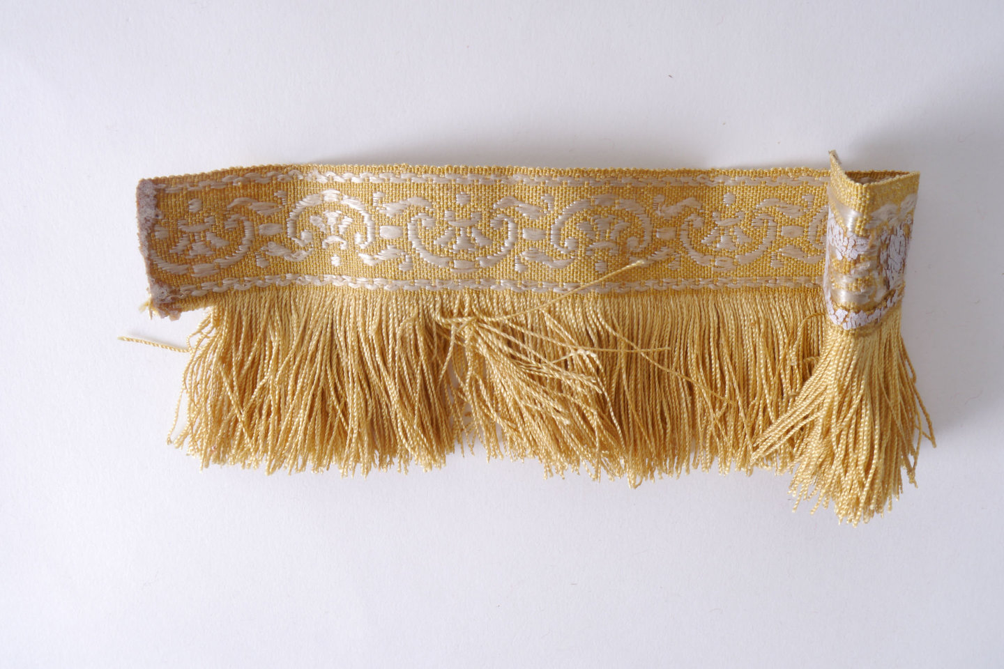 Effilé als onderdeel voor het vervaardigen van passement