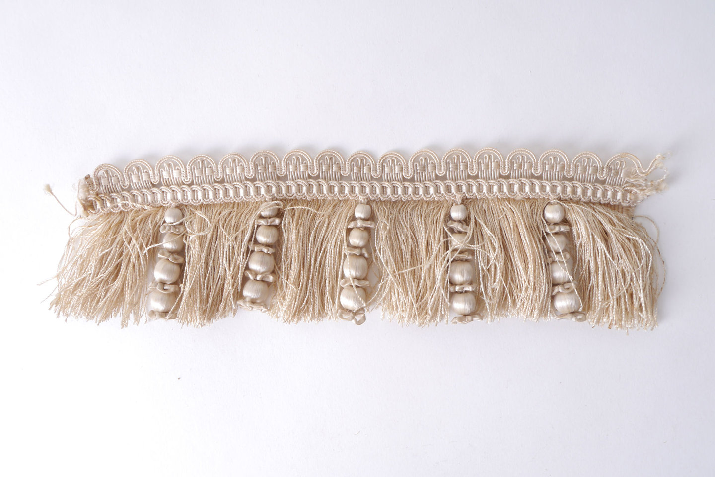 Effilé als onderdeel voor het vervaardigen van passement