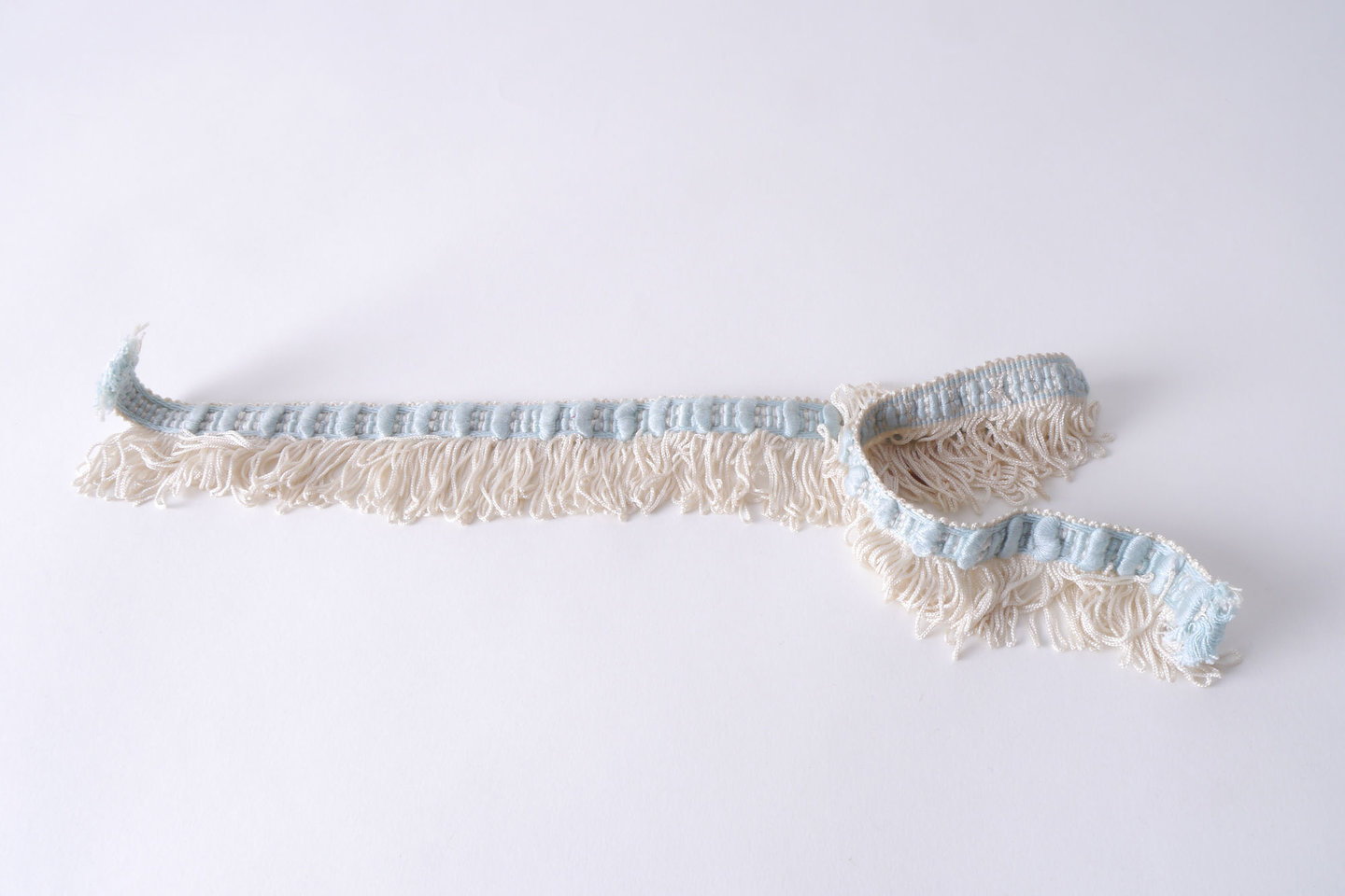 Effilé als onderdeel voor het vervaardigen van passement