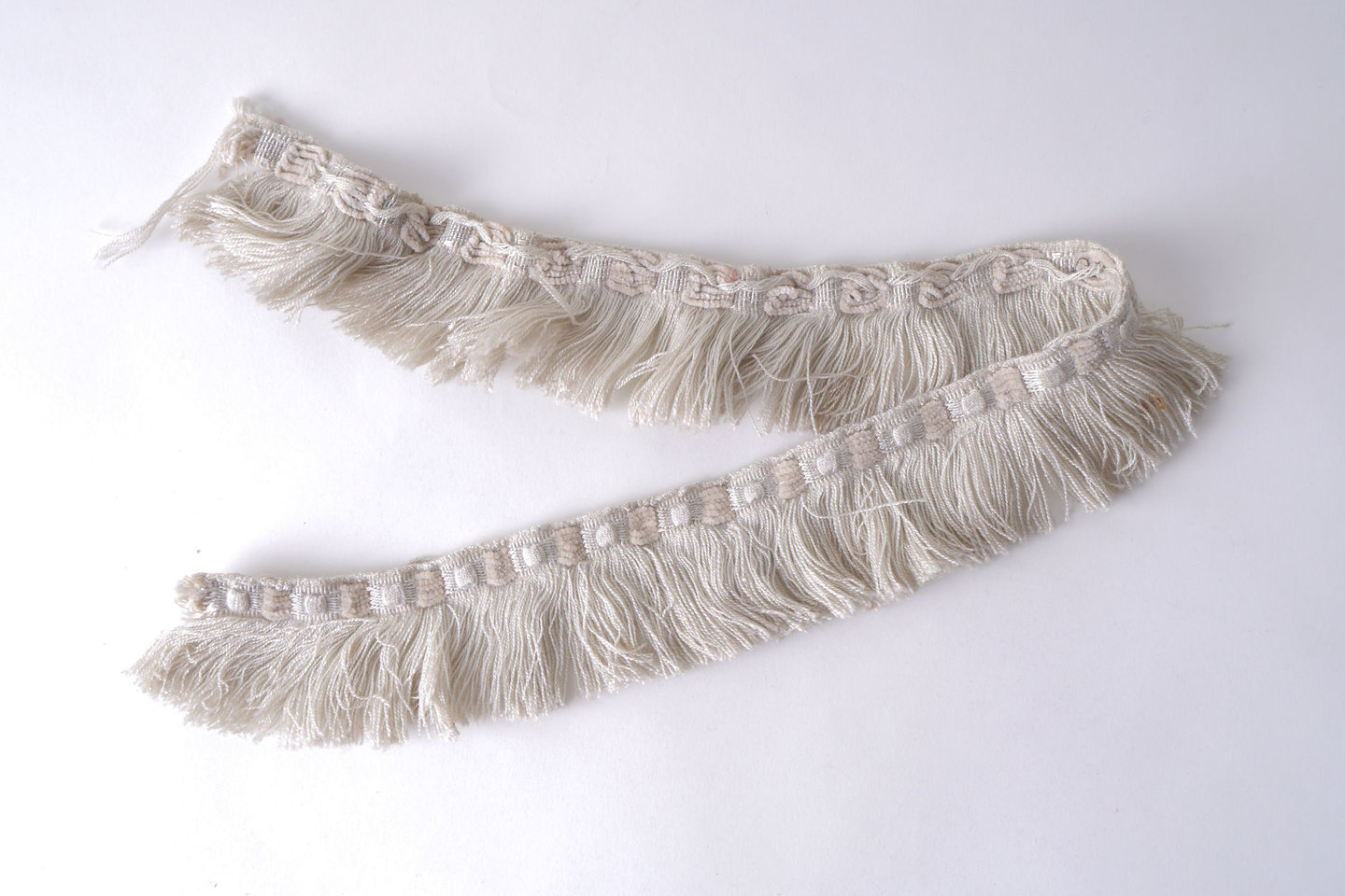 Effilé als onderdeel voor het vervaardigen van passement