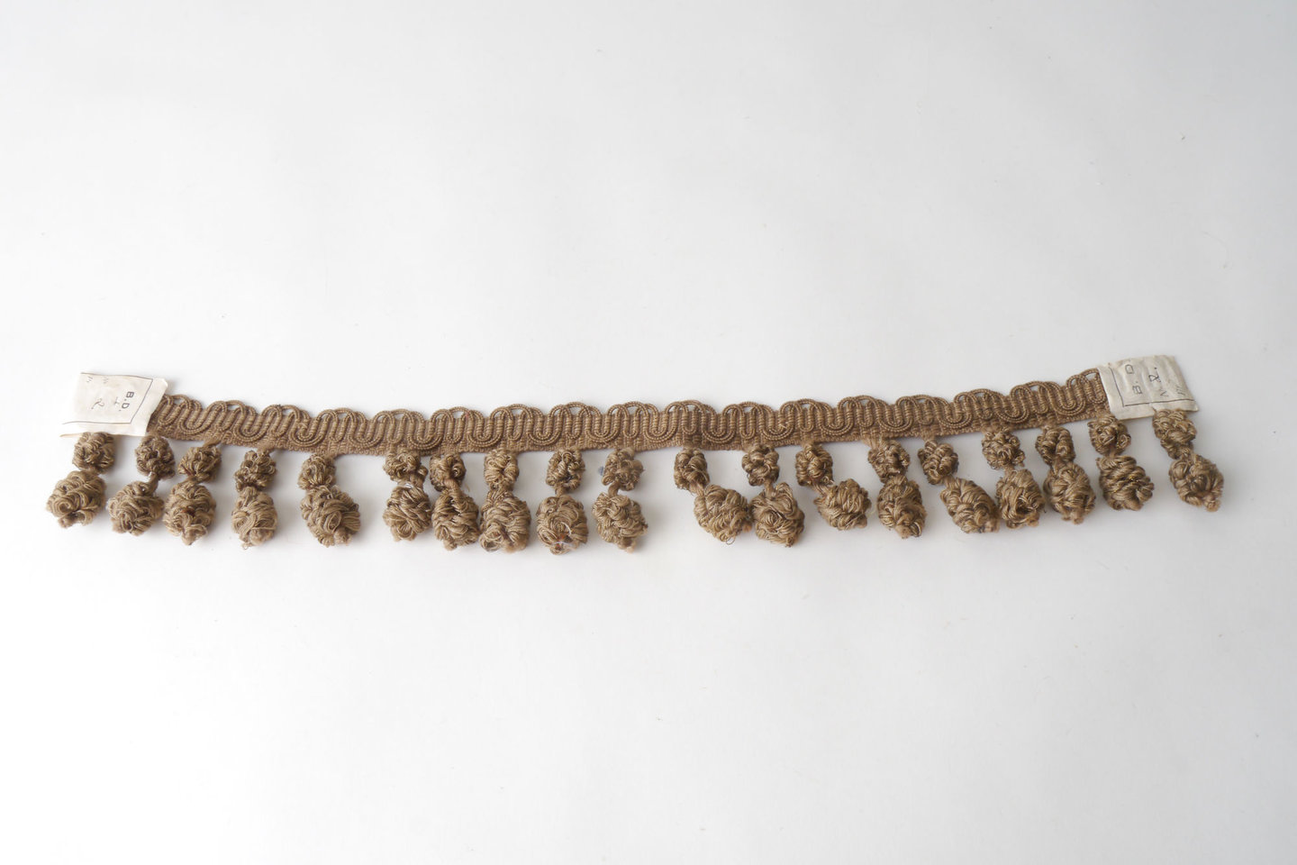 Frange als onderdeel voor het vervaardigen van passement