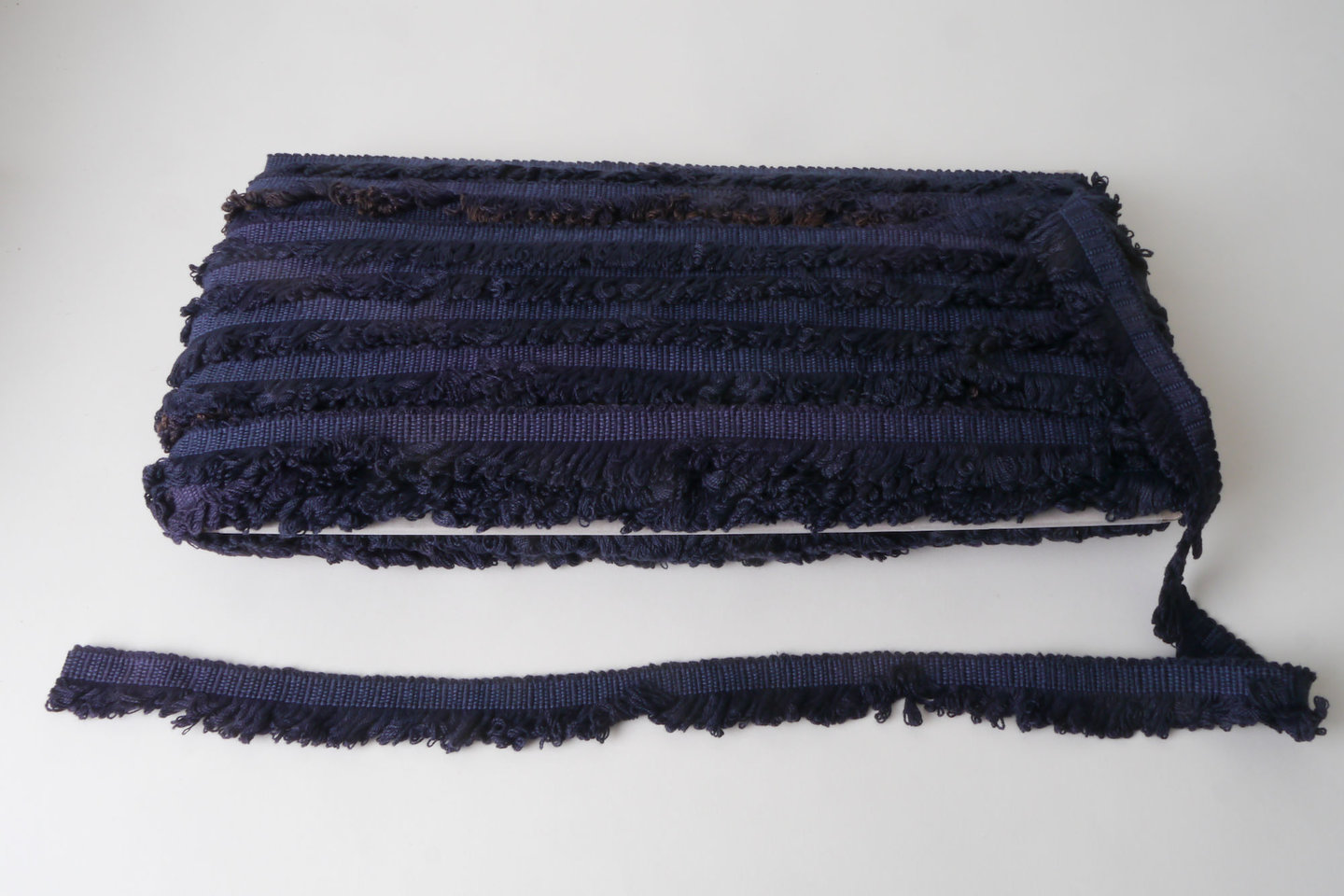 Effilé als onderdeel voor het vervaardigen van passement