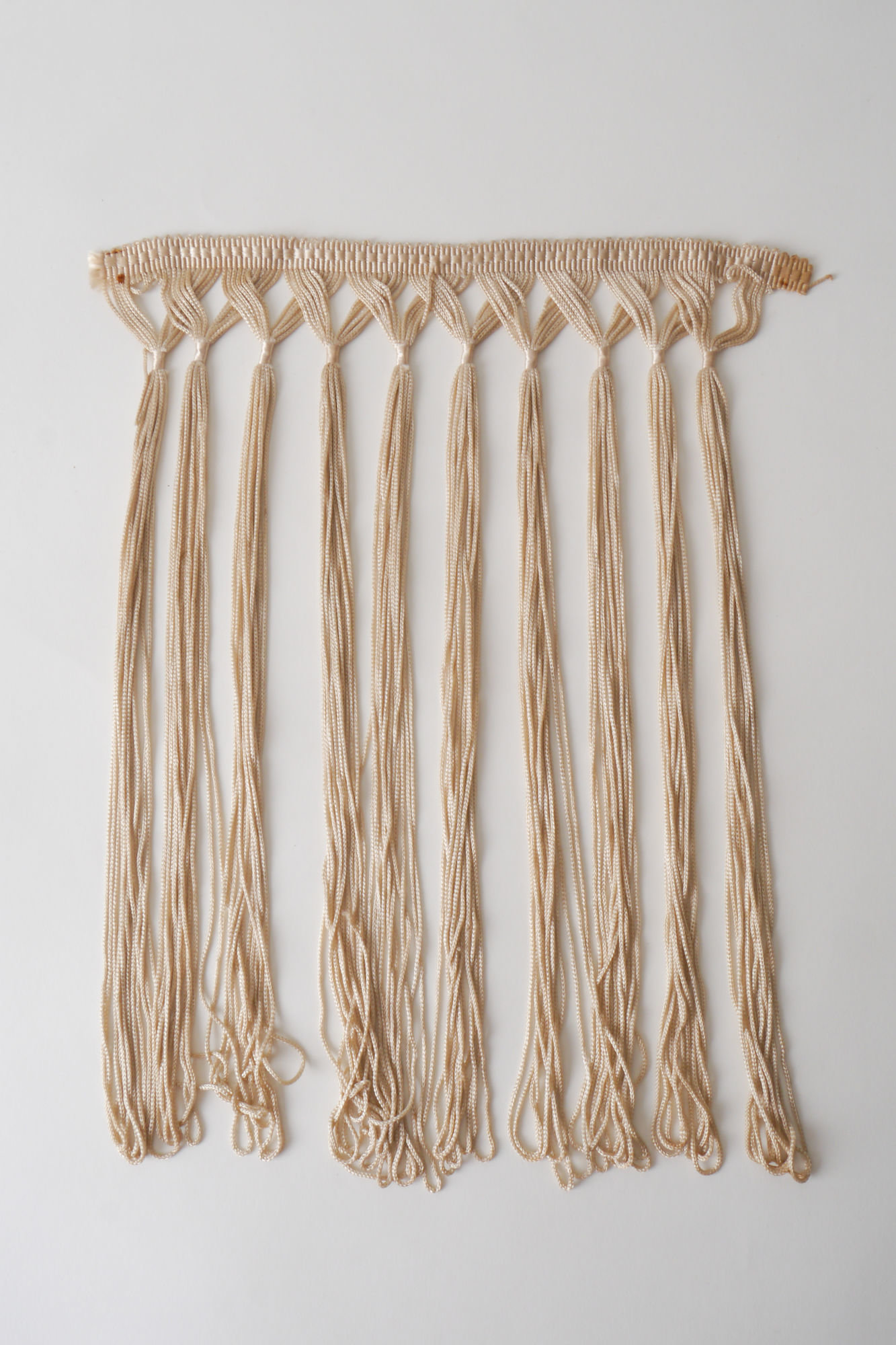 Frange als onderdeel voor het vervaardigen van passement