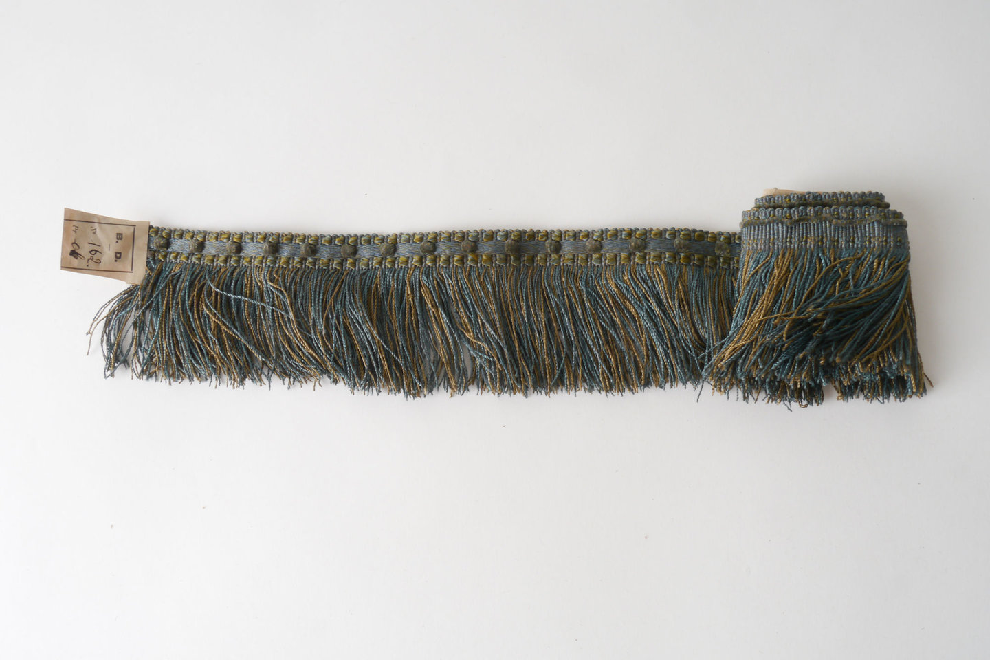 Effilé als onderdeel voor het vervaardigen van passement