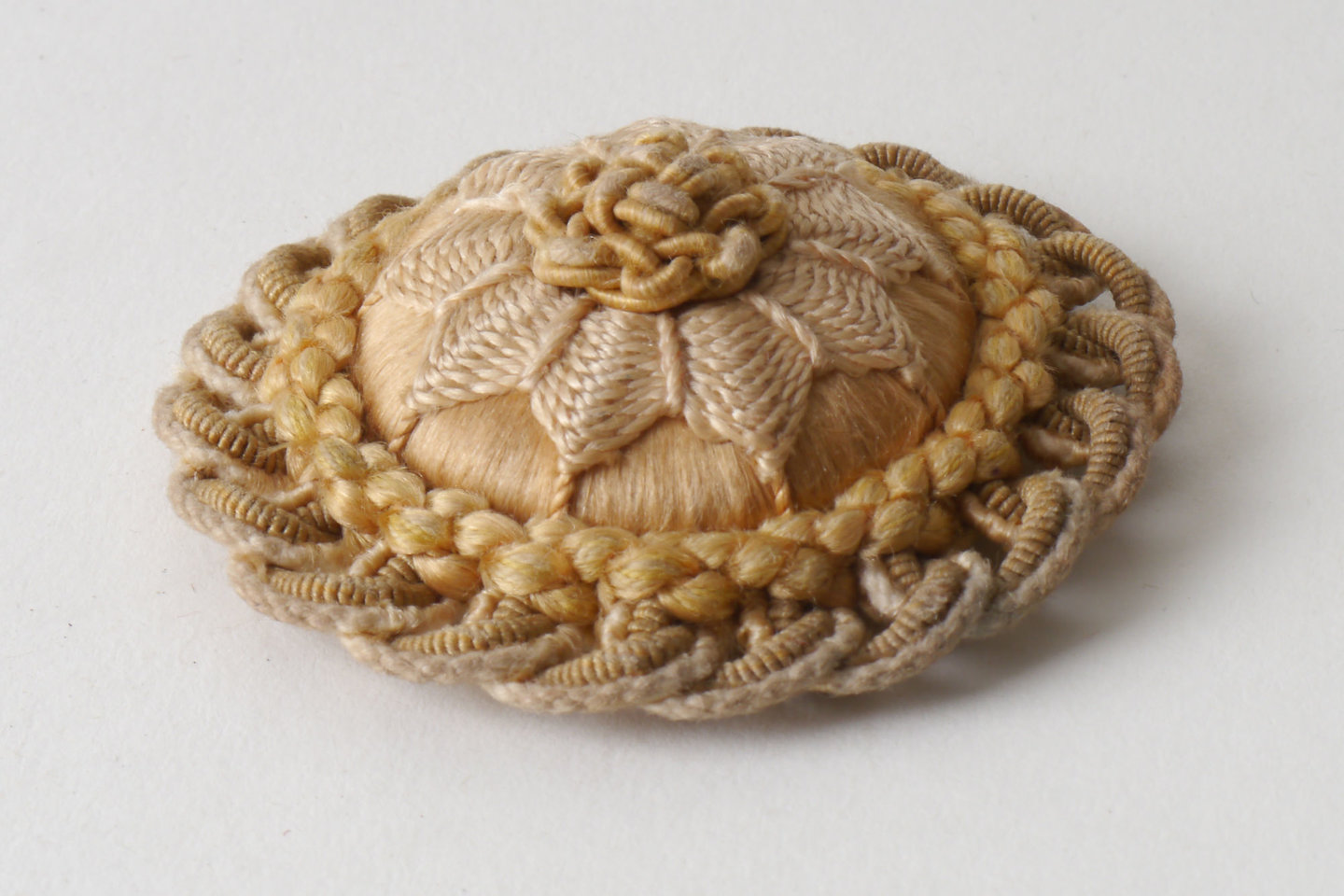 Macaron of rozet als onderdeel voor het vervaardigen van passement