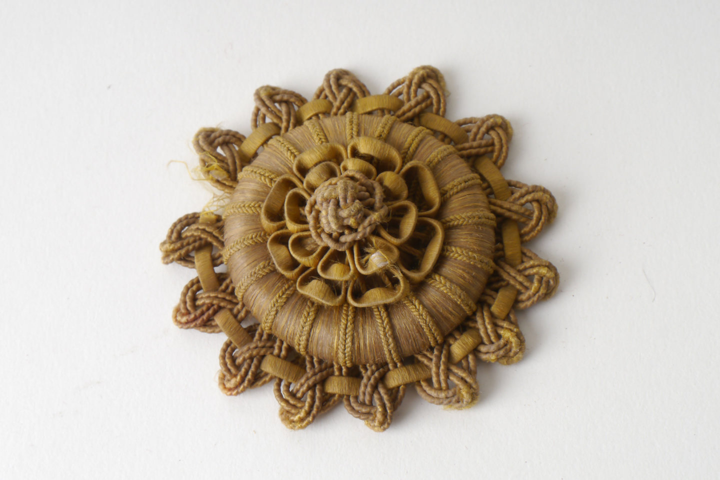 Macaron of rozet als onderdeel voor het vervaardigen van passement