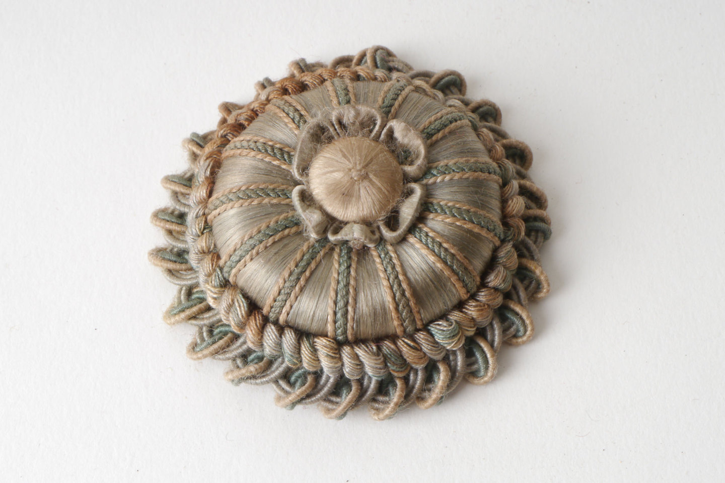 Macaron of rozet als onderdeel voor het vervaardigen van passement