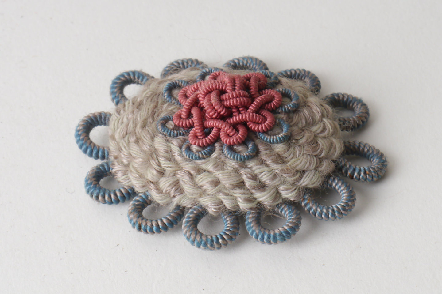 Macaron of rozet als onderdeel voor het vervaardigen van passement