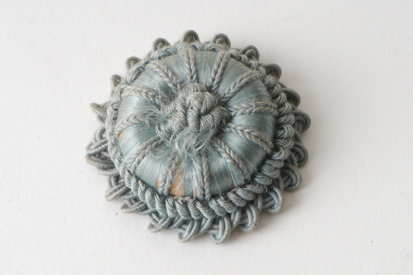 Macaron of rozet als onderdeel voor het vervaardigen van passement