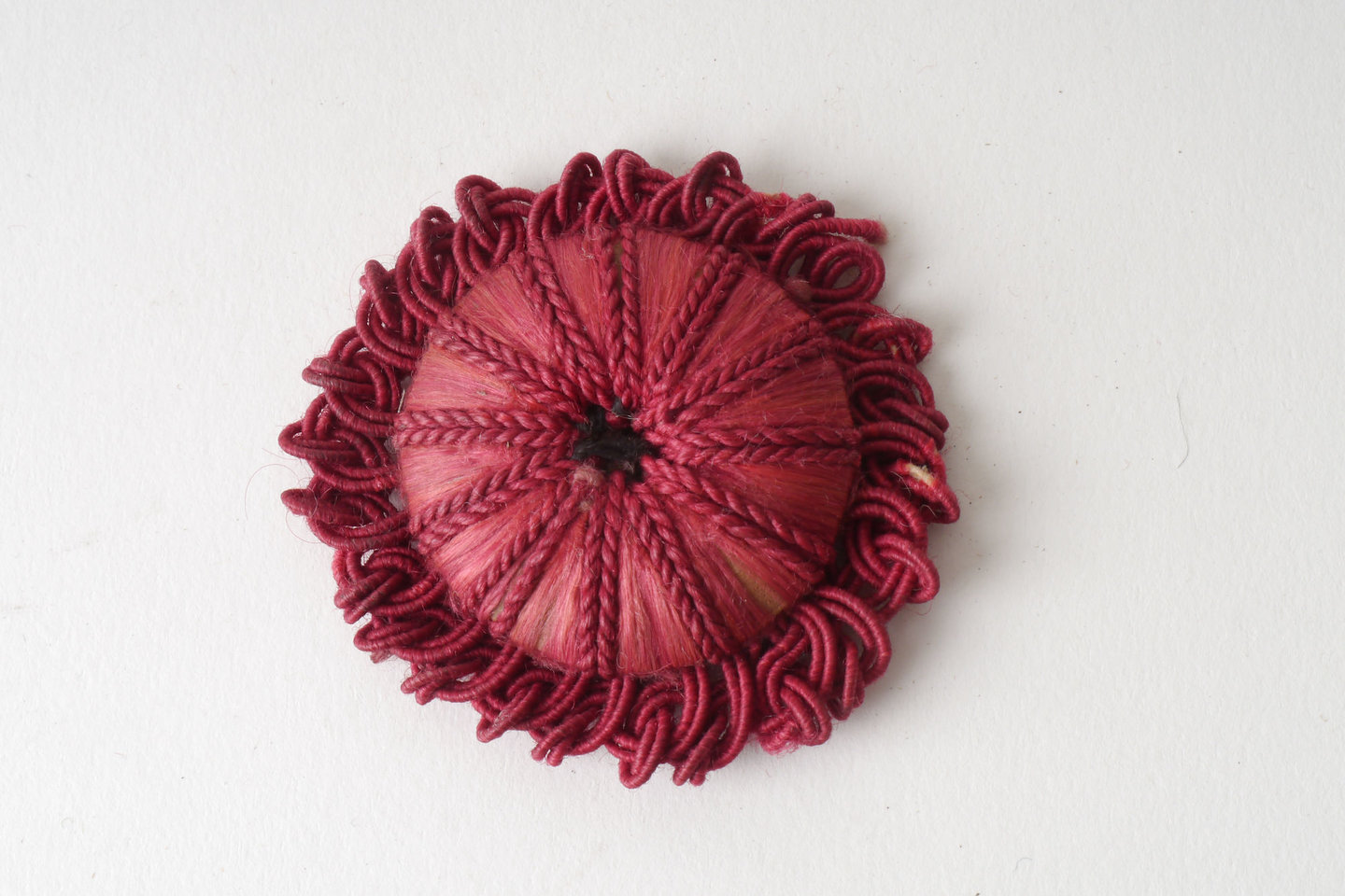 Macaron of rozet als onderdeel voor het vervaardigen van passement