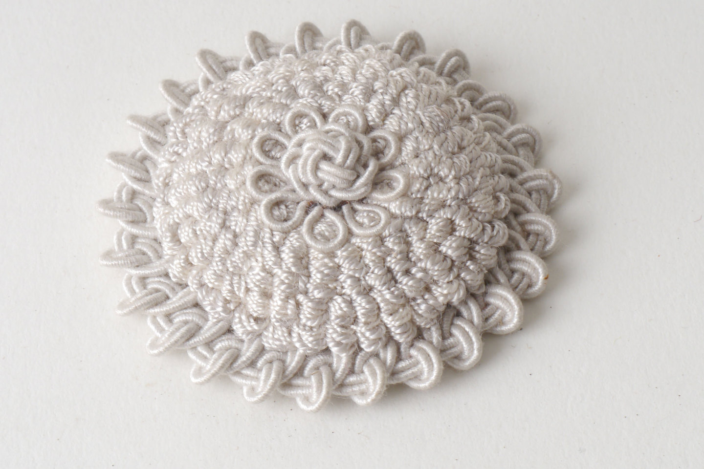 Macaron of rozet als onderdeel voor het vervaardigen van passement