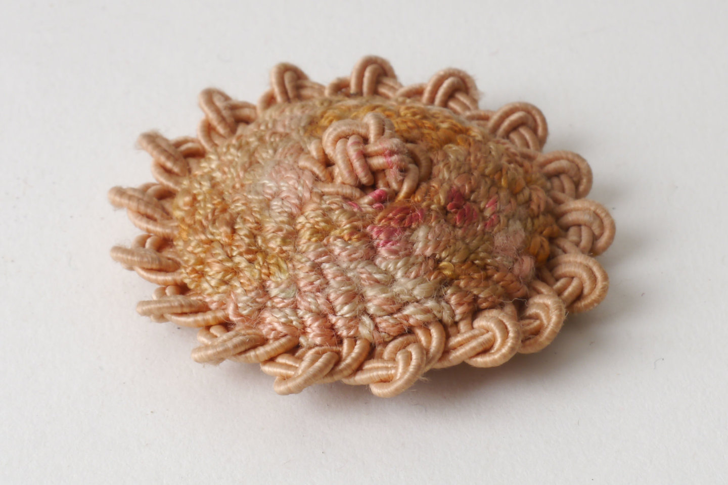 Macaron of rozet als onderdeel voor het vervaardigen van passement