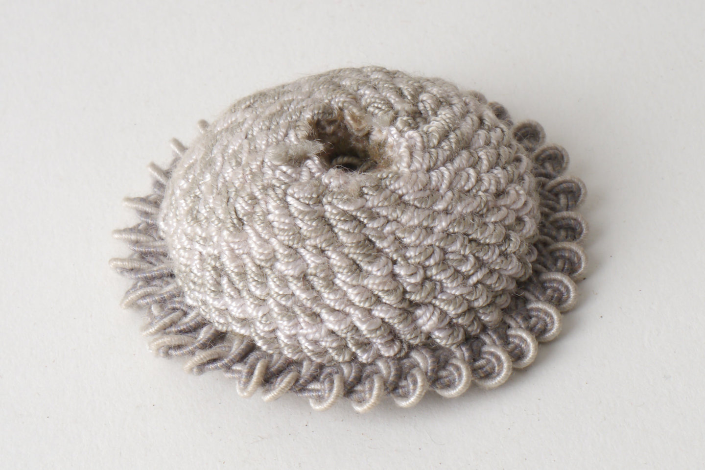 Macaron of rozet als onderdeel voor het vervaardigen van passement