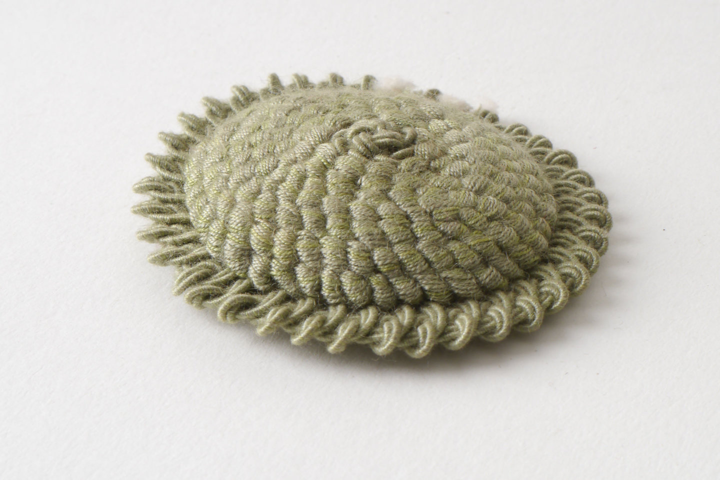 Macaron of rozet als onderdeel voor het vervaardigen van passement