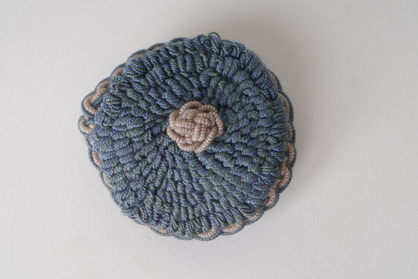 Macaron of rozet als onderdeel voor het vervaardigen van passement