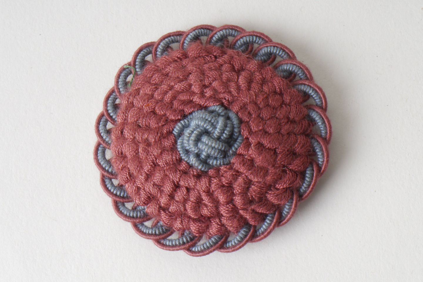 Macaron of rozet als onderdeel voor het vervaardigen van passement