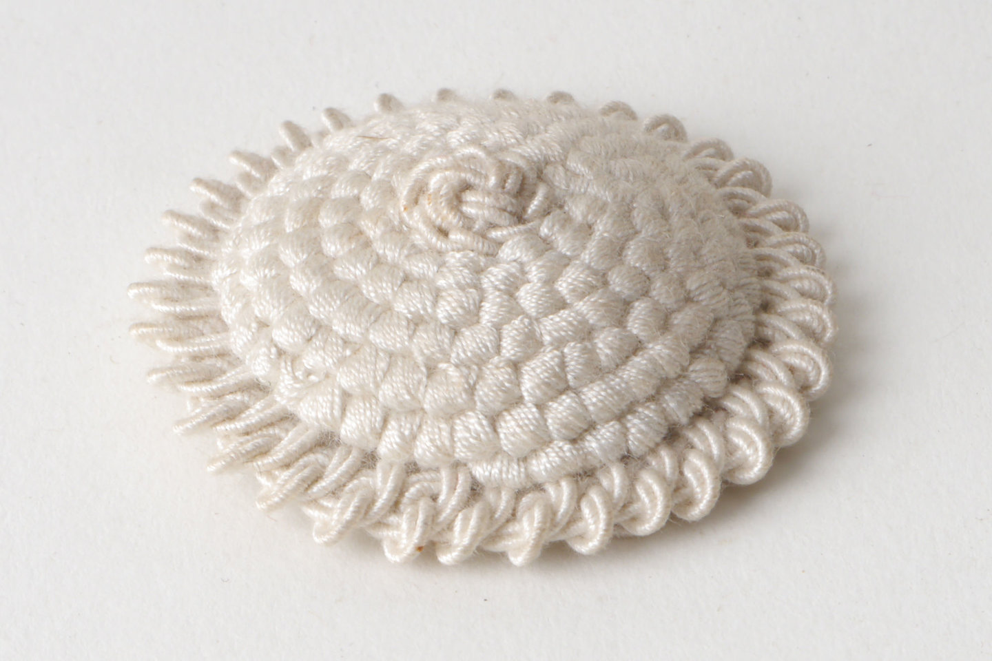 Macaron of rozet als onderdeel voor het vervaardigen van passement