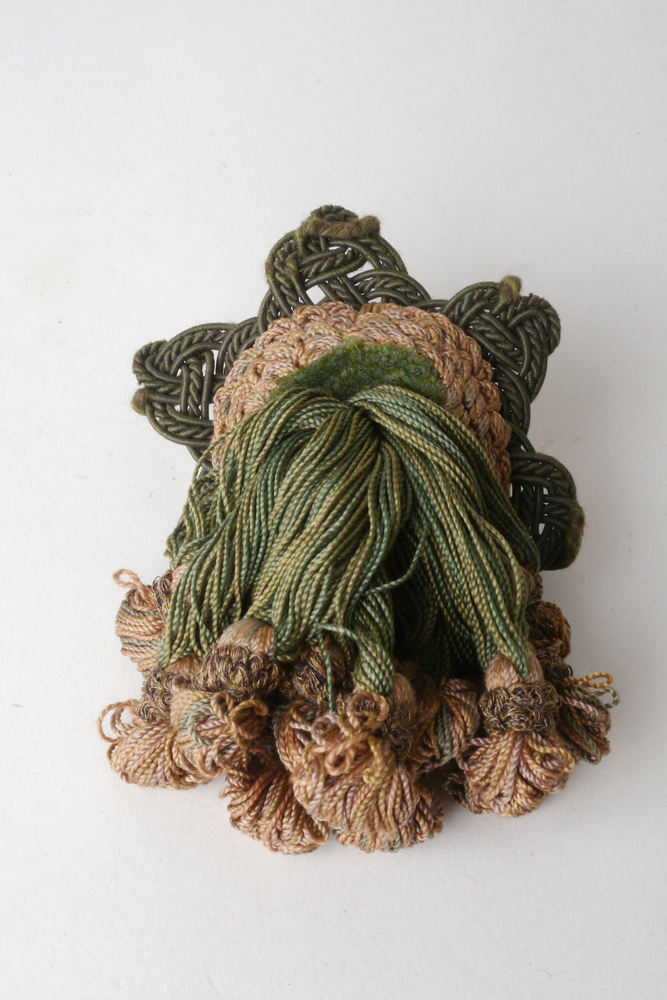 Macaron of rozet als onderdeel voor het vervaardigen van passement