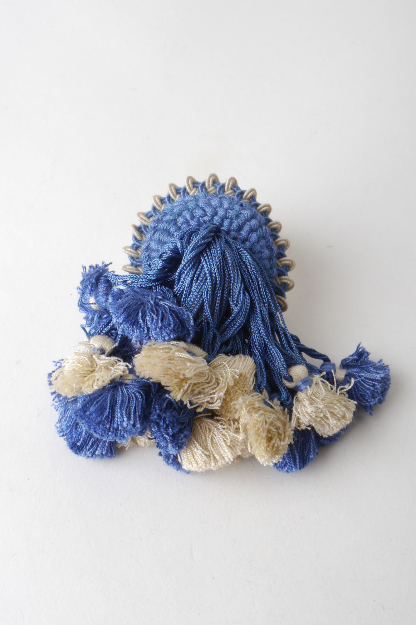 Macaron of rozet als onderdeel voor het vervaardigen van passement