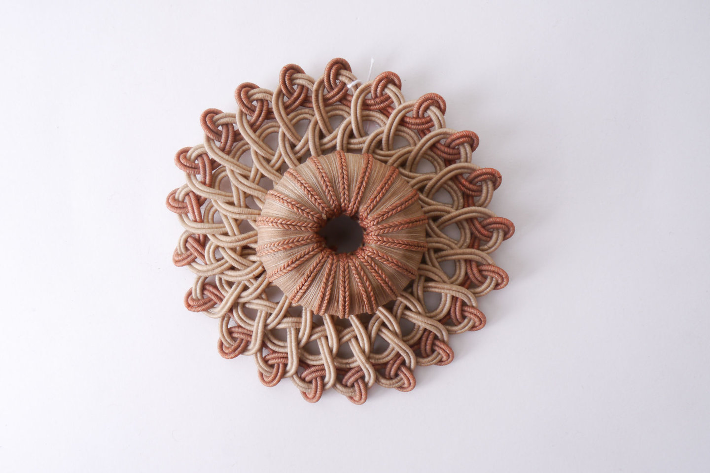 Macaron of rozet als onderdeel voor het vervaardigen van passement