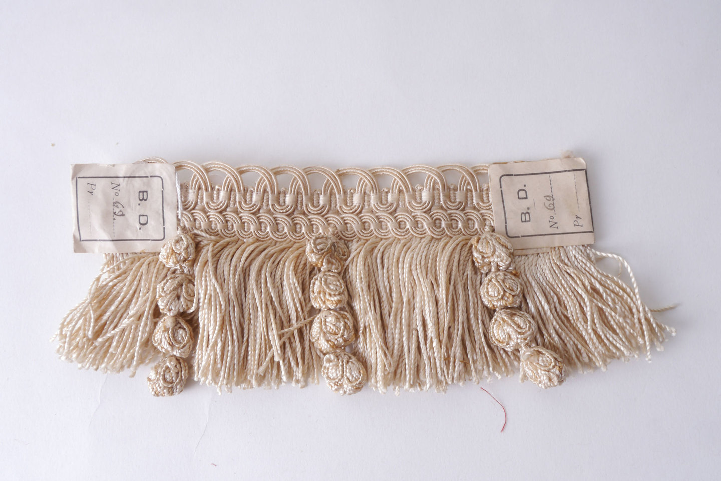 Effilé als onderdeel voor het vervaardigen van passement