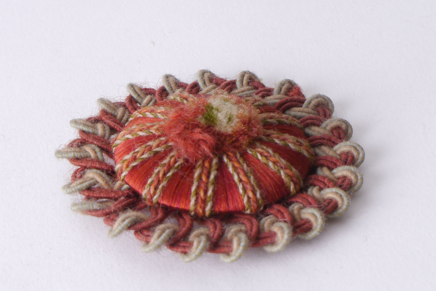 Macaron of rozet als onderdeel voor het vervaardigen van passement