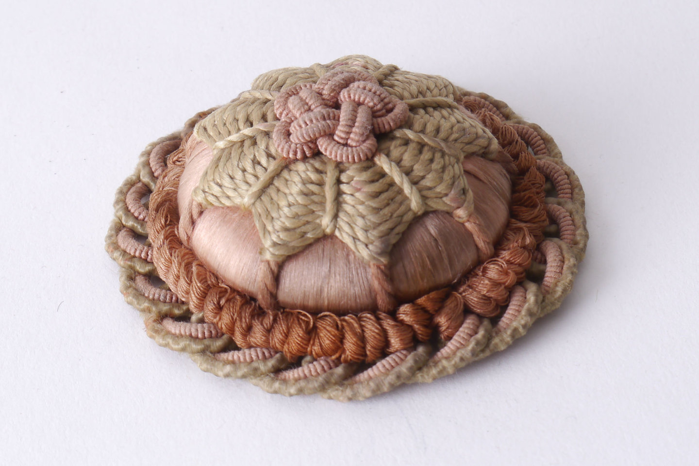 Macaron of rozet als onderdeel voor het vervaardigen van passement