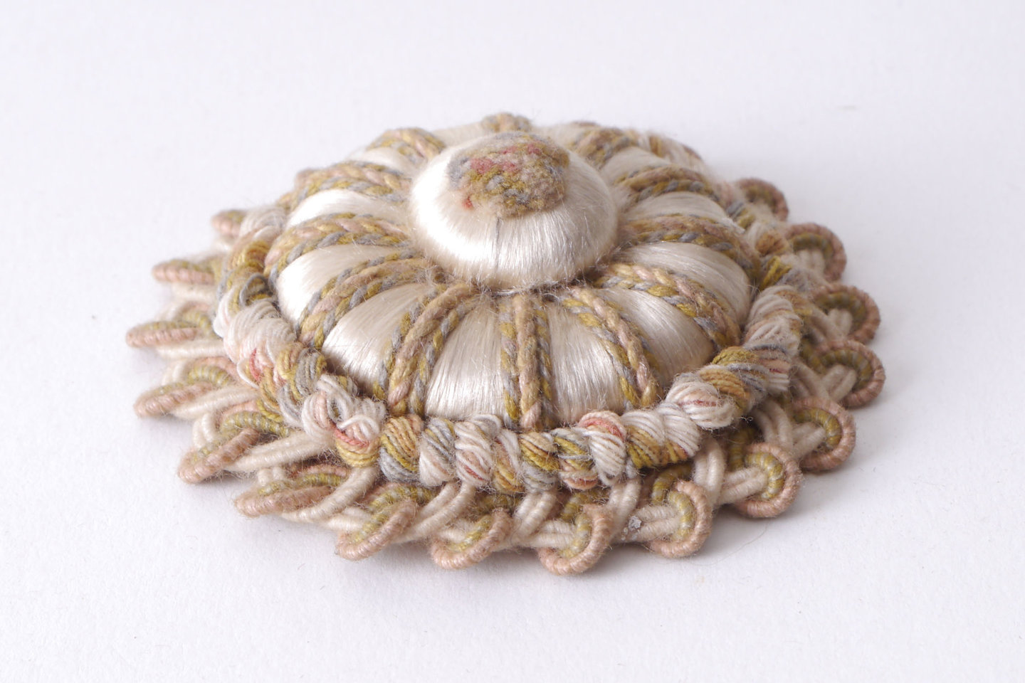 Macaron of rozet als onderdeel voor het vervaardigen van passement