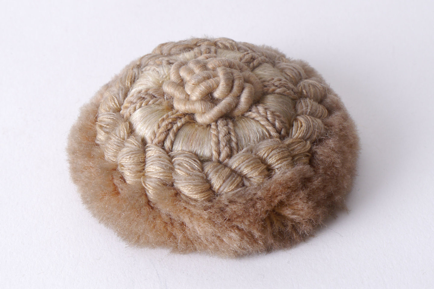 Macaron of rozet als onderdeel voor het vervaardigen van passement