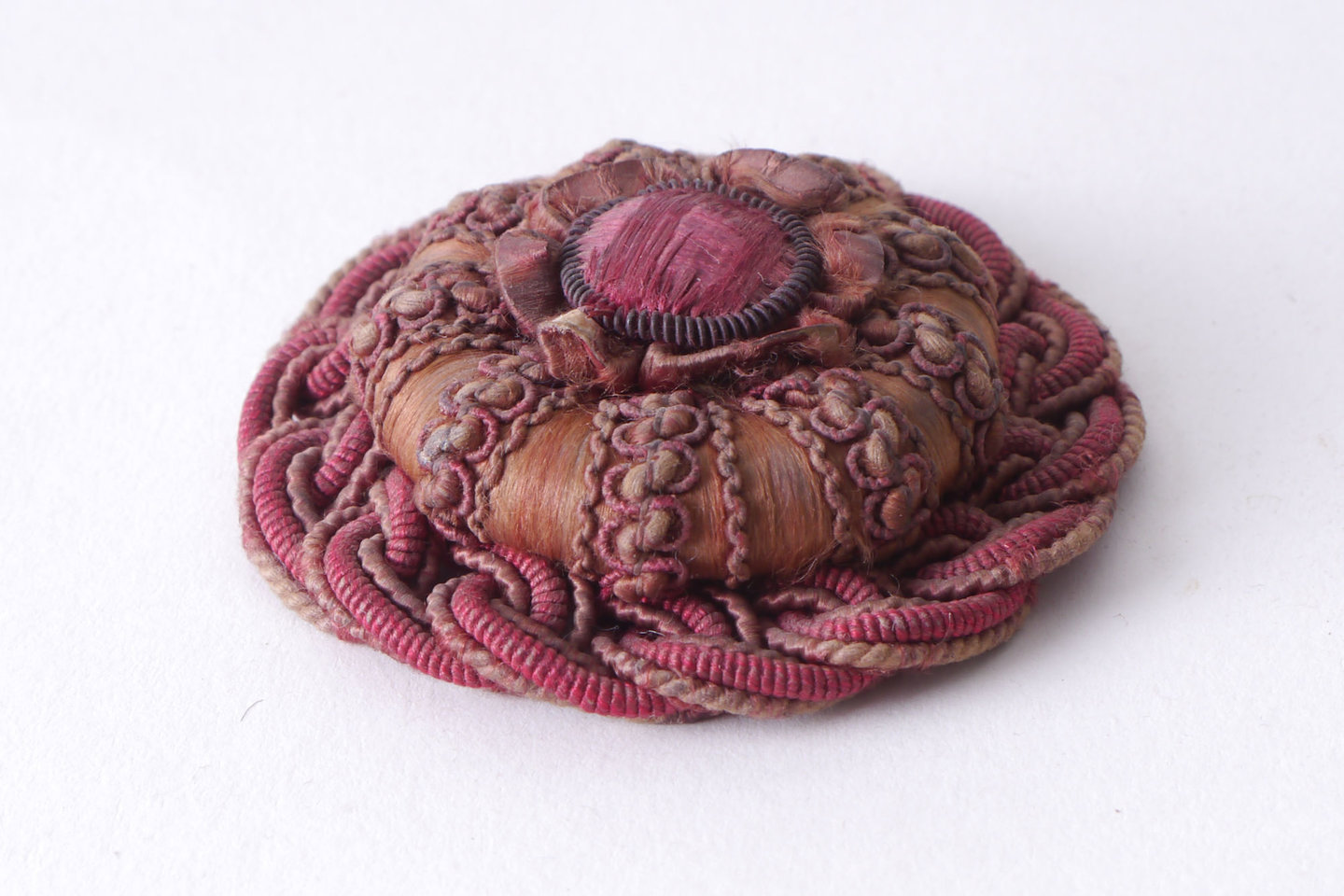 Macaron of rozet als onderdeel voor het vervaardigen van passement