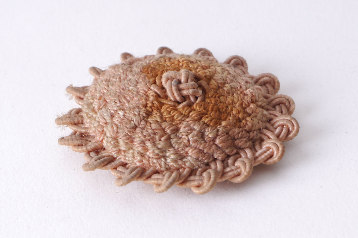 Macaron of rozet als onderdeel voor het vervaardigen van passement