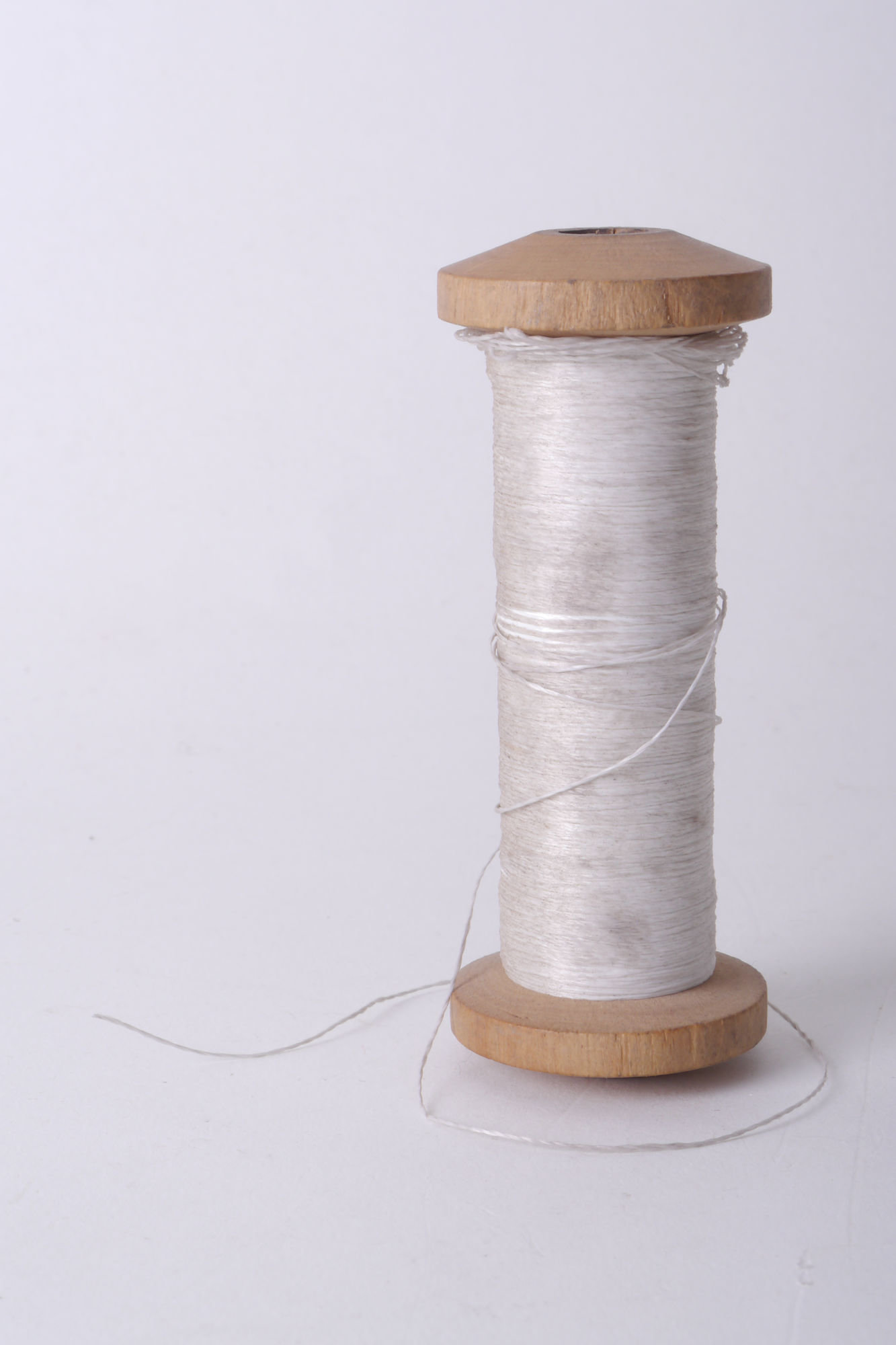 Spoel met garen voor passement