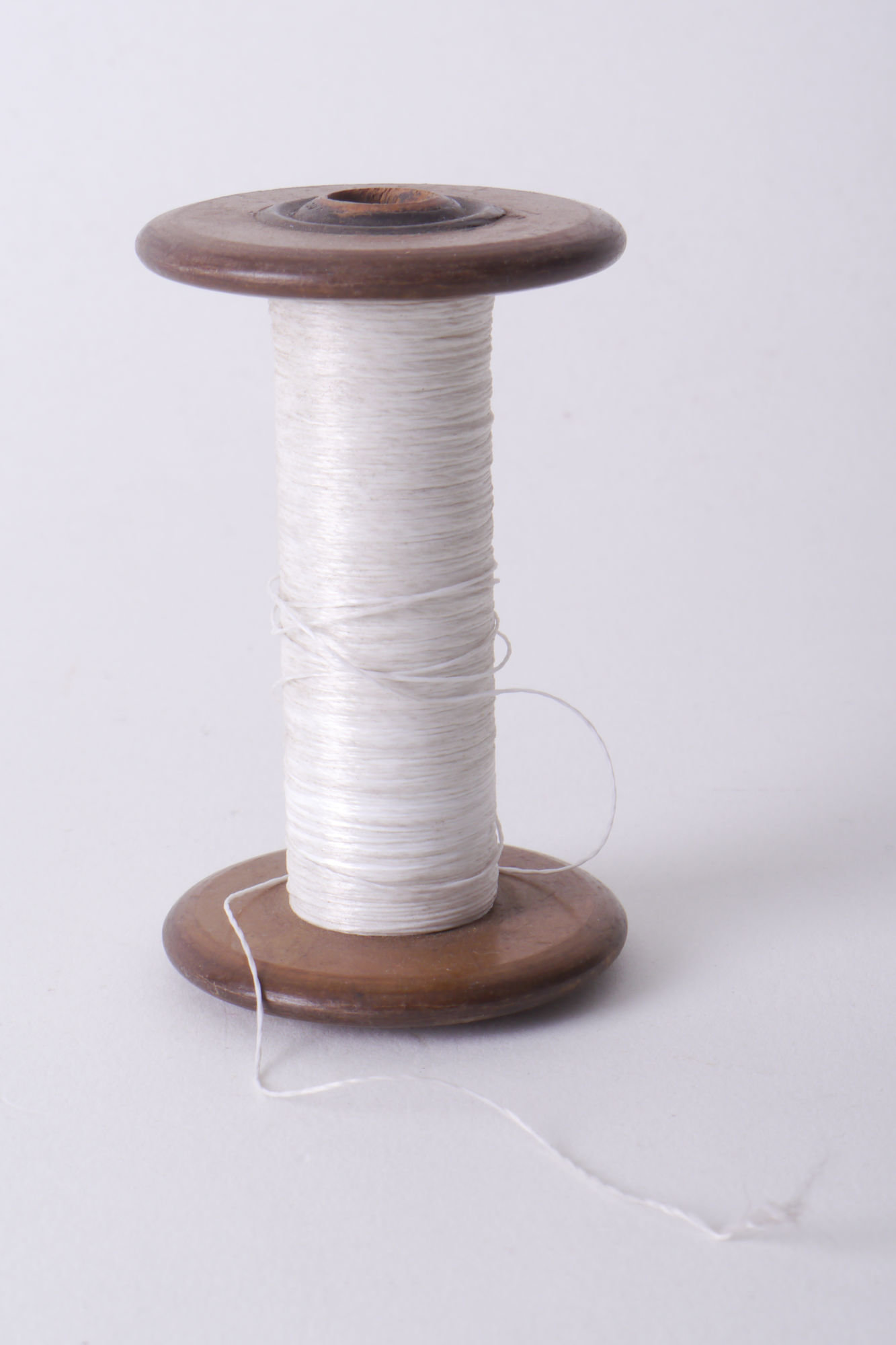 Spoel met garen voor passement