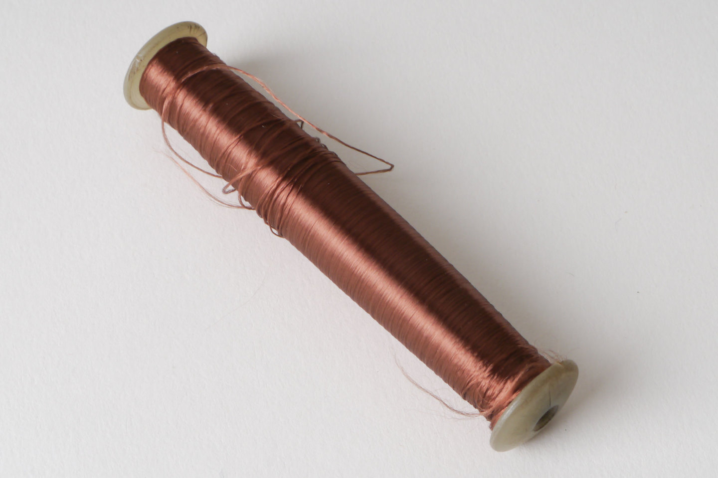 Spoel met inslaggaren voor passement