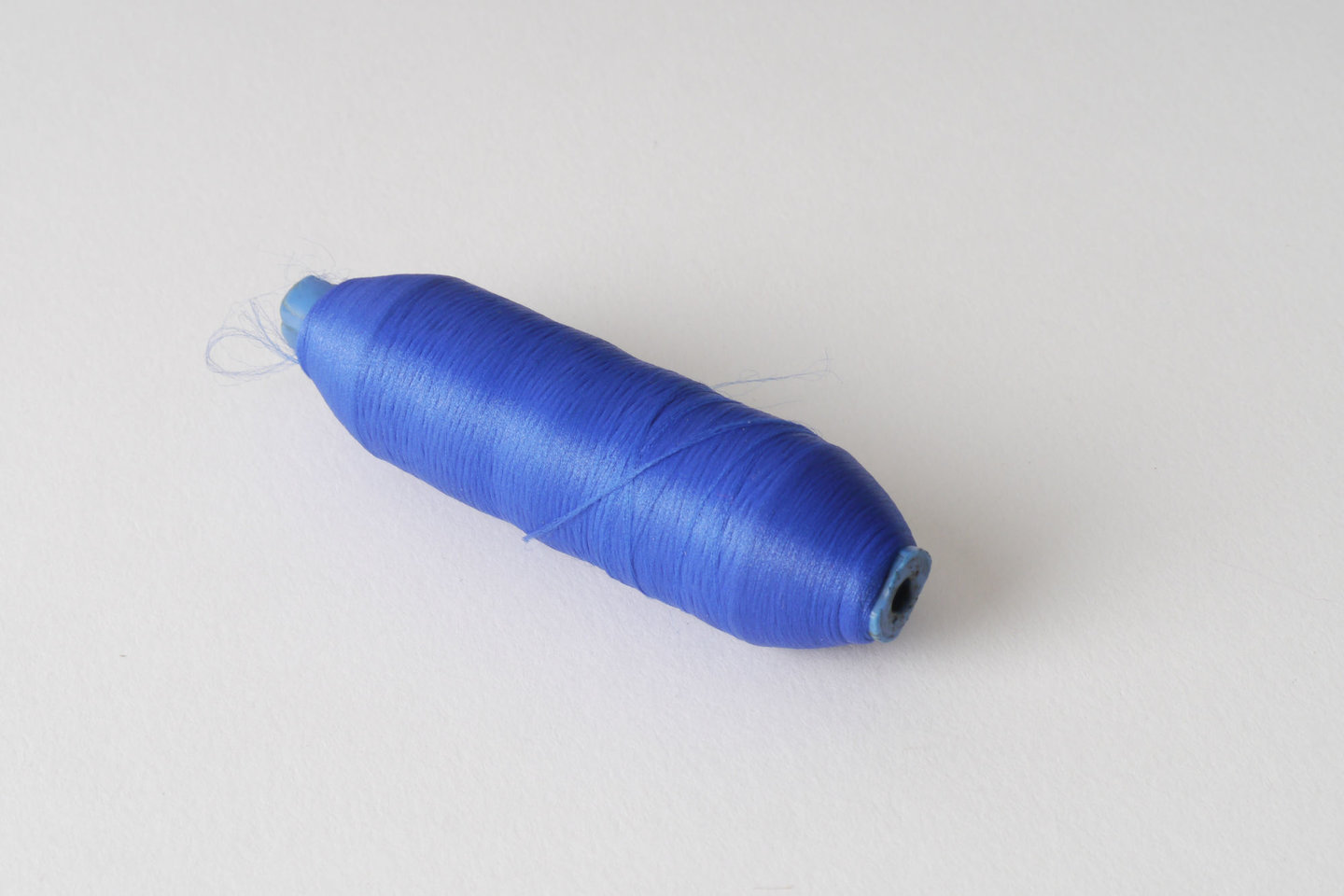 Spoel met inslaggaren voor passement