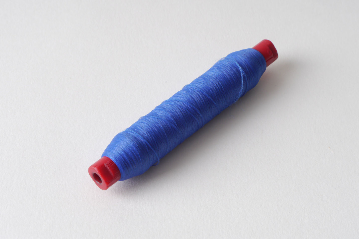 Spoel met inslaggaren voor passement