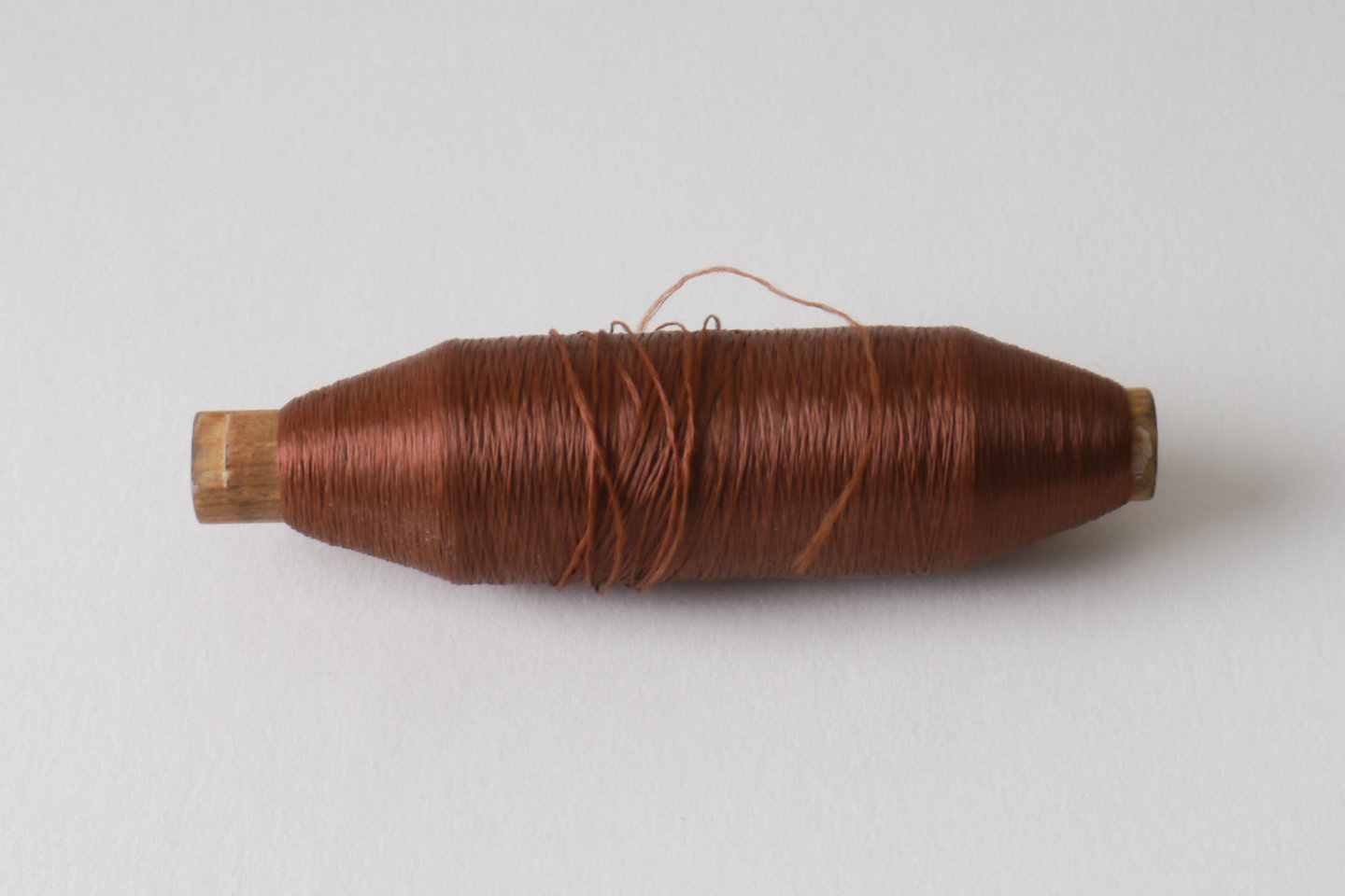 Spoel met inslaggaren voor passement