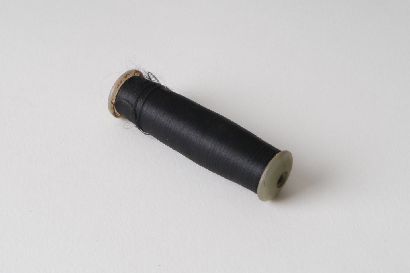 Spoel met inslaggaren voor passement