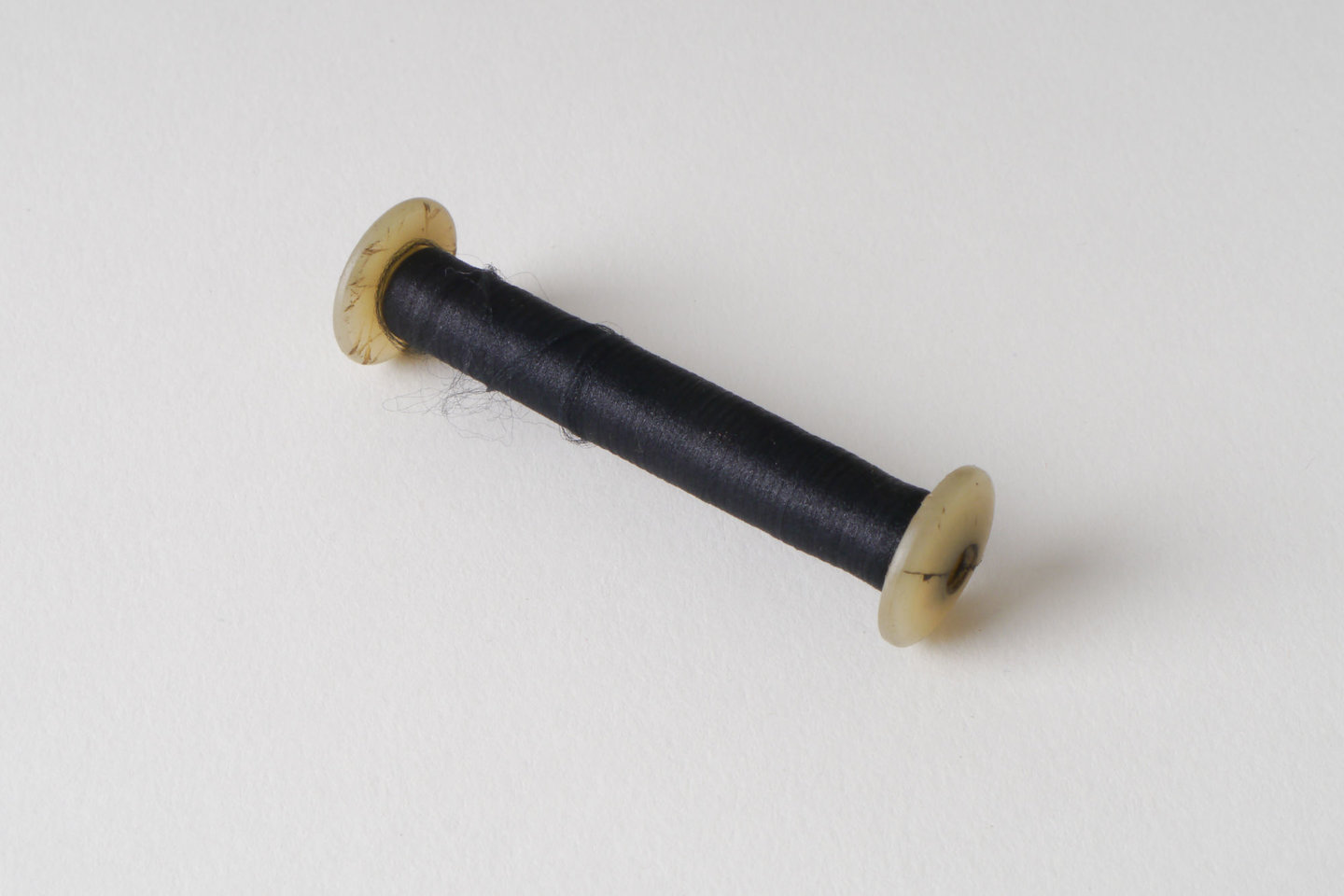 Spoel met inslaggaren voor passement