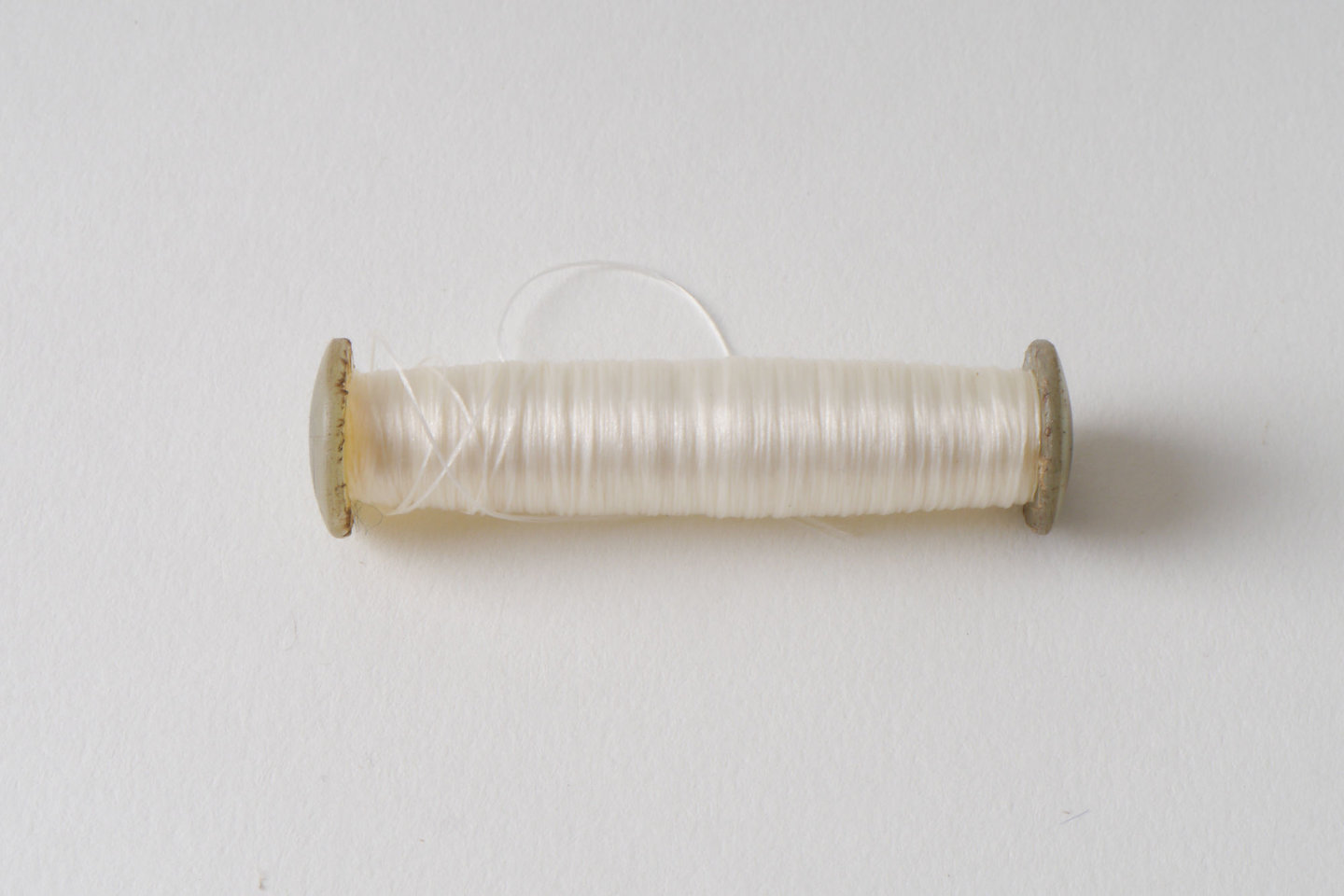 Spoel met inslaggaren voor passement