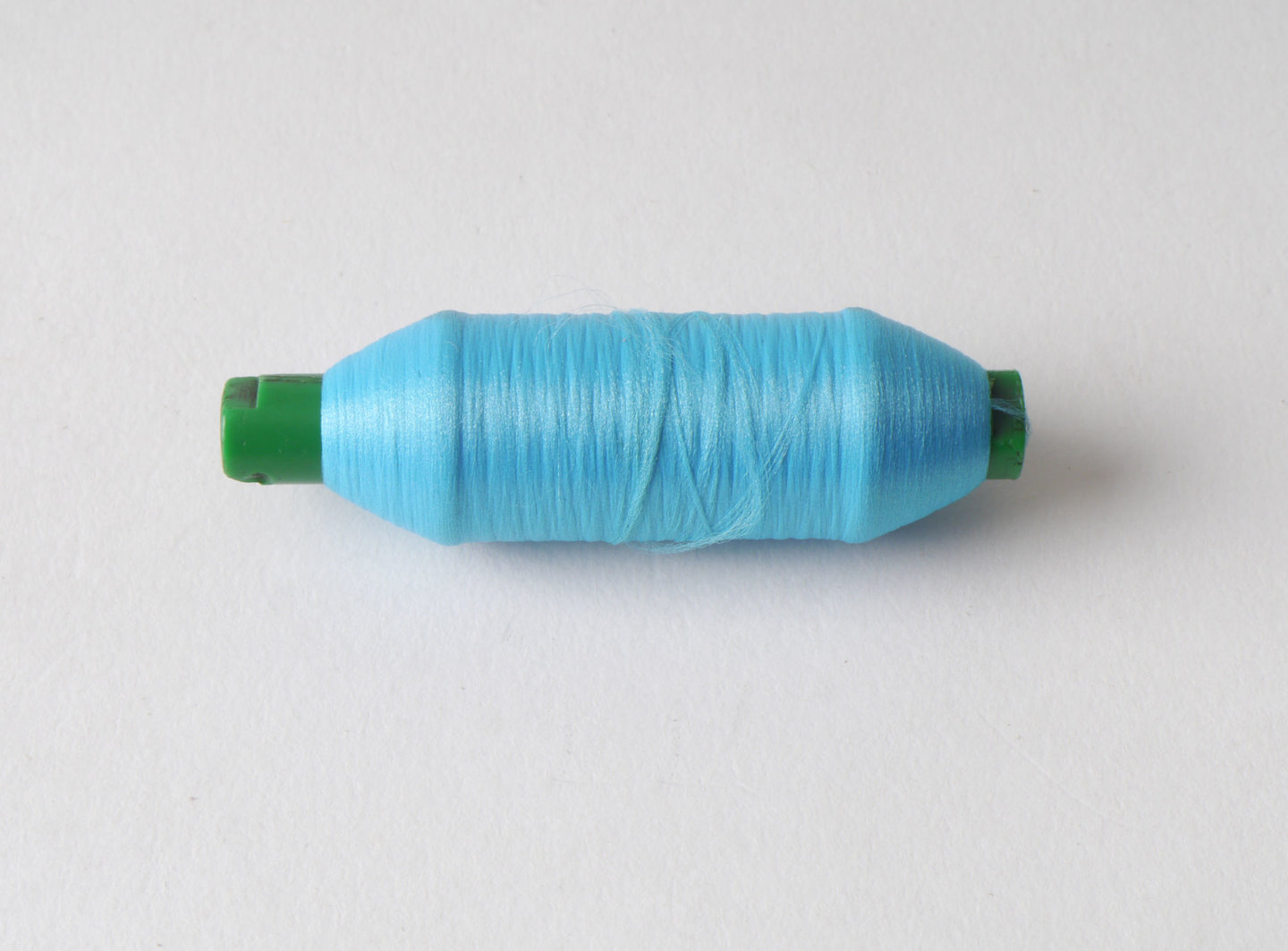 Spoel met inslaggaren voor passement